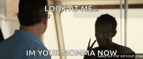 A Man Is Talking To A Young Boy Who Is Giving A Peace Sign And Says Look At Me Im Your Momma Now . GIF