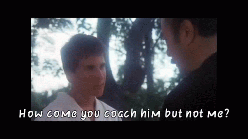A Man Is Talking To Another Man In Front Of Trees And The Words `` How Come You Coach Him But Not Me '' GIF