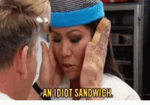 A Man Is Touching A Woman 'S Face While Holding A Sandwich In Front Of Her . GIF