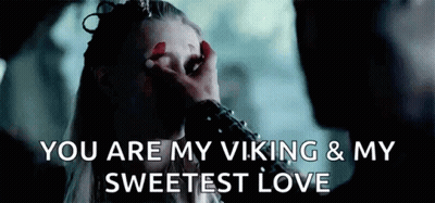 A Man Is Touching A Woman 'S Face With His Hand And Says `` You Are My Viking & My Sweetest Love '' . GIF