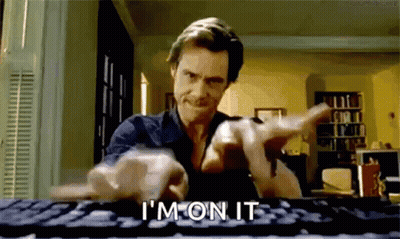 A Man Is Typing On A Computer Keyboard And Pointing At The Camera While Saying `` I 'M On It '' . GIF