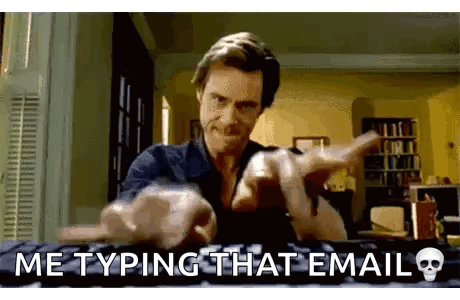 A Man Is Typing On A Keyboard And Pointing At The Camera While A Skull Is On The Keyboard . GIF