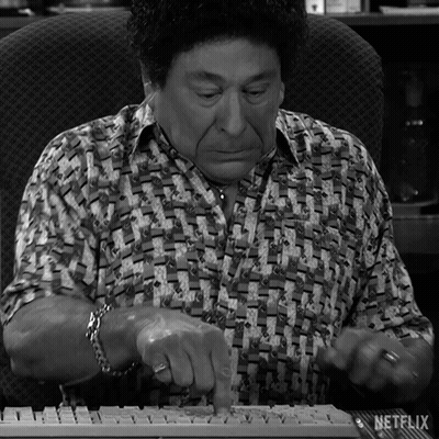 A Man Is Typing On A Keyboard With Netflix Written On The Bottom Right GIF