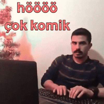 A Man Is Typing On A Keyboard With The Words Hoööö Çok Komik Written Above Him GIF
