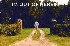 A Man Is Walking Down A Dirt Road With The Words `` I 'M Out Of Here '' . GIF
