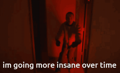A Man Is Walking Down A Hallway With The Words Im Going More Insane Over Time Behind Him GIF