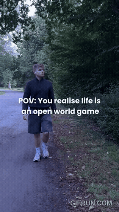 A Man Is Walking Down A Path With The Words " You Realise Life Is An Open World Game " GIF