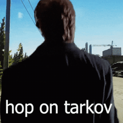 A Man Is Walking Down A Street With The Words Hop On Tarkov On His Back GIF