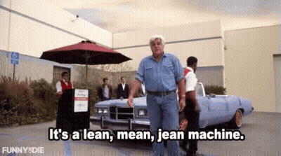 A Man Is Walking In Front Of A Car And Says It 'S A Lean Mean Jean Machine GIF