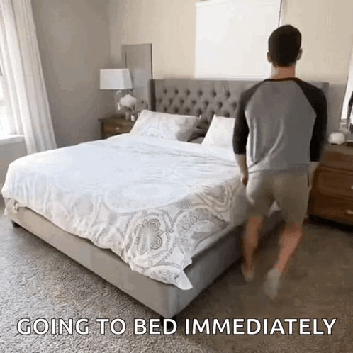 A Man Is Walking Towards A Bed With The Words " Going To Bed Immediately " Above Him GIF