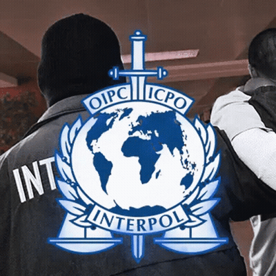 A Man Is Wearing A Black Jacket With The Word Interpol On The Back GIF