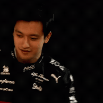 A Man Is Wearing A Black Shirt That Says Amx On It GIF