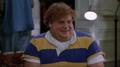 A Man Is Wearing A Blue And Yellow Striped Shirt GIF