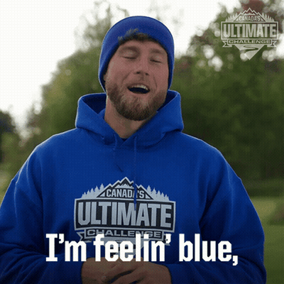 A Man Is Wearing A Blue Hoodie That Says Ultimate Challenge GIF