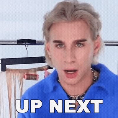 A Man Is Wearing A Blue Shirt And Says Up Next GIF