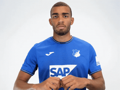 A Man Is Wearing A Blue Shirt With The Word Sap On It GIF