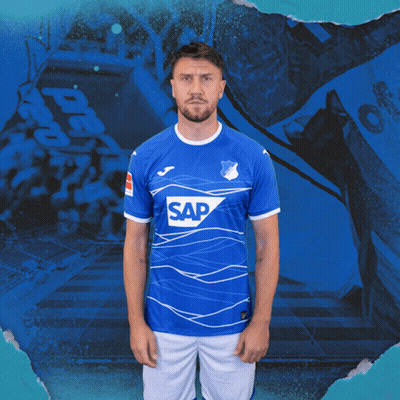 A Man Is Wearing A Blue Shirt With The Word Sap On It GIF