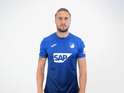 A Man Is Wearing A Blue Shirt With The Word Sap On It GIF