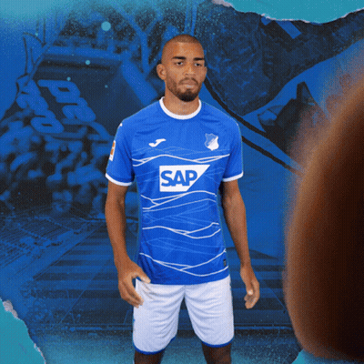 A Man Is Wearing A Blue Shirt With The Word Sap On It GIF