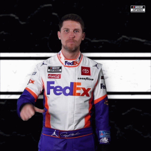 A Man Is Wearing A Fedex Uniform And Pointing GIF
