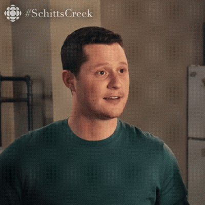 A Man Is Wearing A Green Shirt That Says Thank You GIF