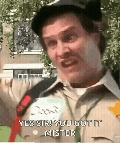 A Man Is Wearing A Hat And A Name Tag That Says ' Yes Sir You Got It Mister ' On It . GIF