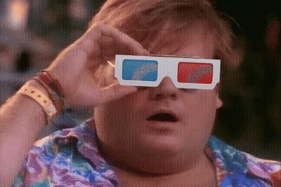 A Man Is Wearing A Pair Of 3D Glasses With A Surprised Look On His Face GIF