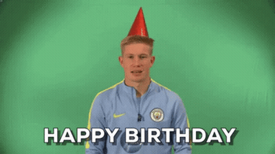 A Man Is Wearing A Party Hat And Saying Happy Birthday GIF