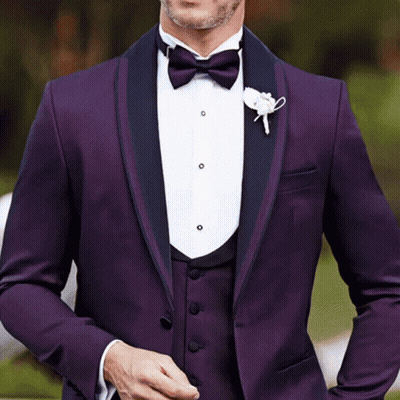 A Man Is Wearing A Purple Tuxedo With A Bow Tie GIF