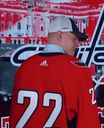 A Man Is Wearing A Red Jersey With The Number 22 On It GIF