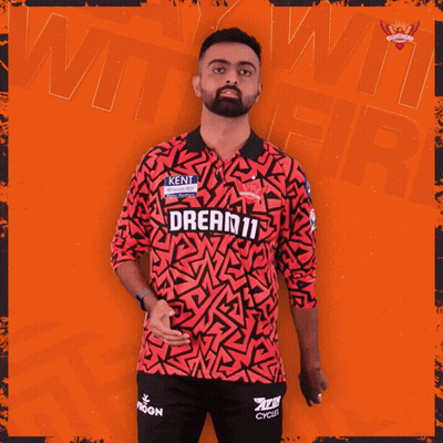 A Man Is Wearing A Red Shirt That Says Dream11 GIF
