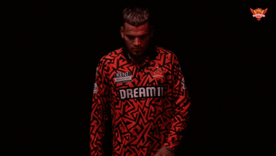 A Man Is Wearing A Red Shirt That Says Kent On It GIF