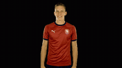 A Man Is Wearing A Red Shirt With A Puma Logo On It GIF