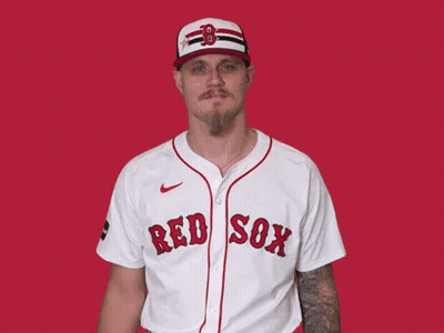 A Man Is Wearing A Red Sox Jersey And Waving GIF