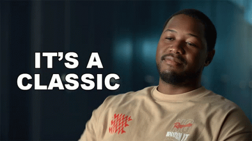 A Man Is Wearing A Shirt That Says It 'S A Classic On It GIF