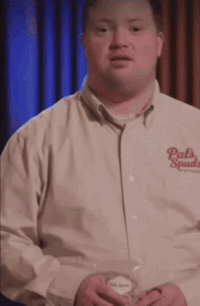 A Man Is Wearing A Shirt That Says Pats Spades On It GIF
