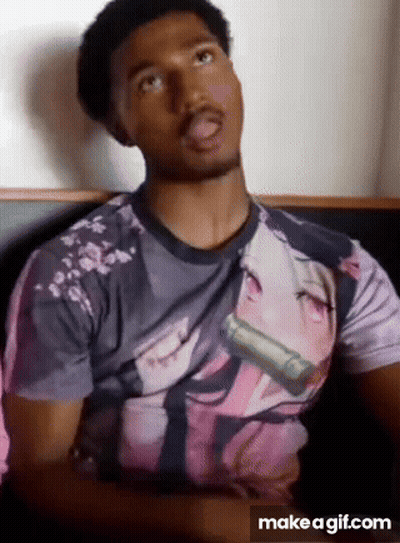 A Man Is Wearing A T-Shirt With A Picture Of A Girl On It . GIF
