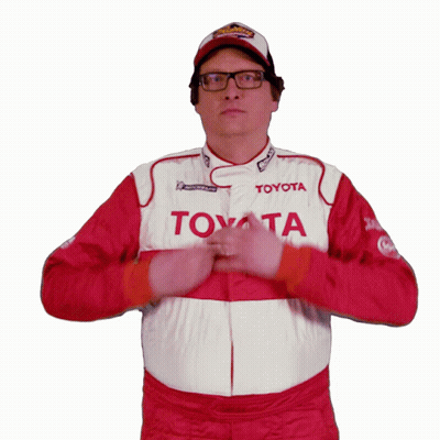 A Man Is Wearing A Toyota Racing Suit GIF
