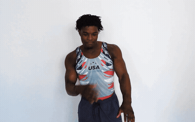 A Man Is Wearing A Usa Tank Top GIF