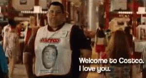 A Man Is Wearing A Vest That Says Welcome To Costco I Love You GIF