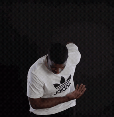 A Man Is Wearing A White Adidas Shirt GIF