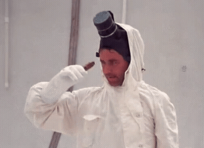 A Man Is Wearing A White Coat And Gloves And A Top Hat GIF