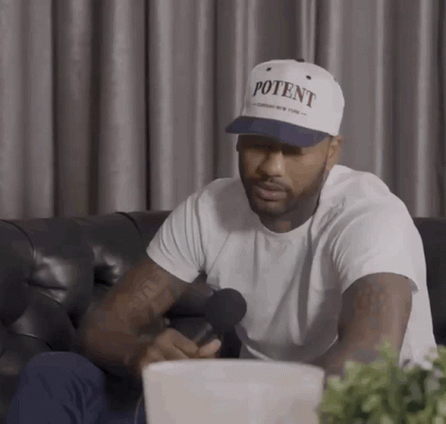 A Man Is Wearing A White Hat That Says Potent GIF