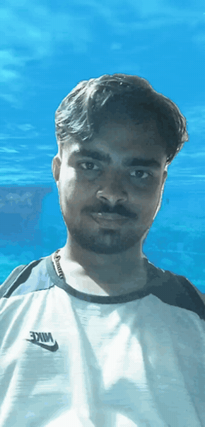 A Man Is Wearing A White Nike Shirt GIF