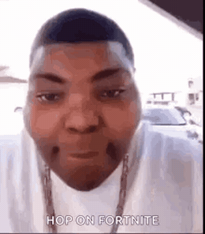 A Man Is Wearing A White Shirt And A Chain Around His Neck . GIF