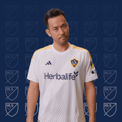 A Man Is Wearing A White Shirt That Says Herbalife GIF