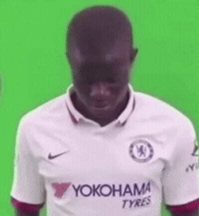 A Man Is Wearing A White Yokohama Tyres Jersey . GIF
