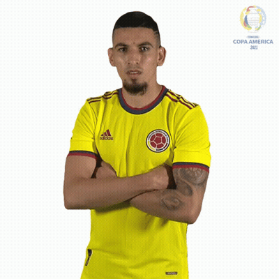 A Man Is Wearing A Yellow Adidas Shirt GIF
