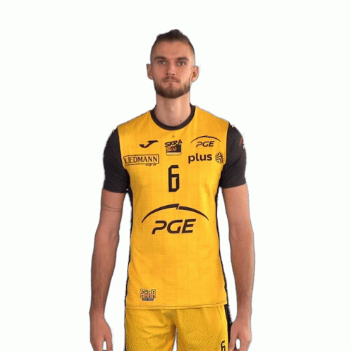 A Man Is Wearing A Yellow And Black Pge Plus Shirt GIF