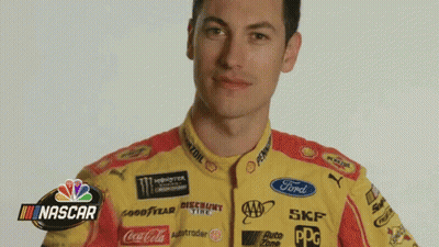 A Man Is Wearing A Yellow And Red Nascar Shirt GIF